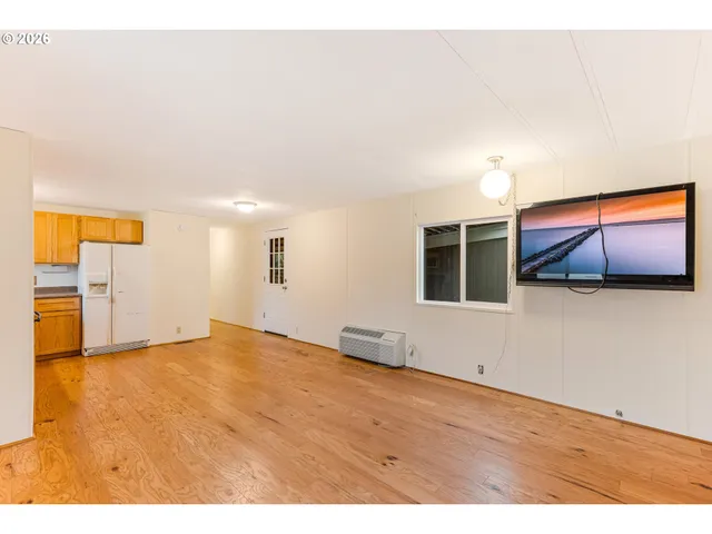 a view of a room with a wooden floor