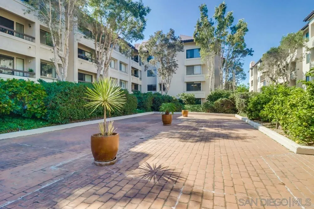 5665 Friars Road, Unit 219 San Diego, CA 92110 - Photo 23 of 34 a building view with a garden space