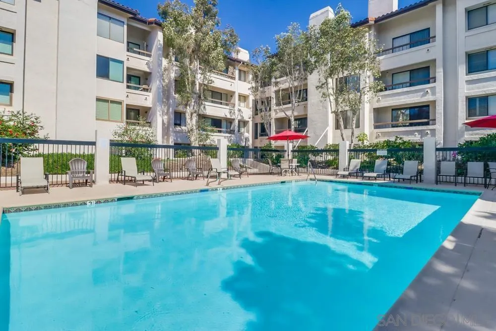 5665 Friars Road, Unit 219 San Diego, CA 92110 - Photo 24 of 34 a swimming pool view with a outdoor seating