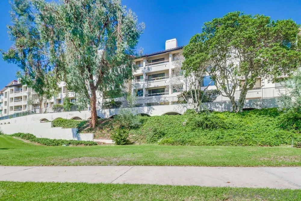 5665 Friars Road, Unit 219 San Diego, CA 92110 - Photo 29 of 34 a view of a house with a yard and sitting area