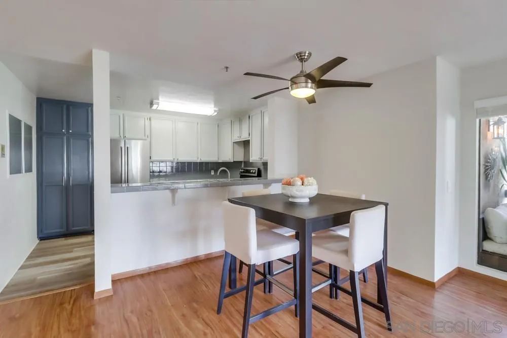 5665 Friars Road, Unit 219 San Diego, CA 92110 - Photo 4 of 34 a kitchen with a table and chairs in it