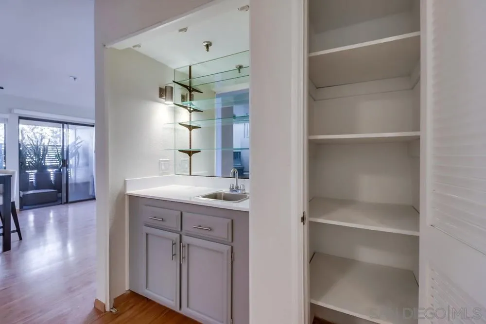 5665 Friars Road, Unit 219 San Diego, CA 92110 - Photo 9 of 34 a kitchen with a refrigerator and a sink