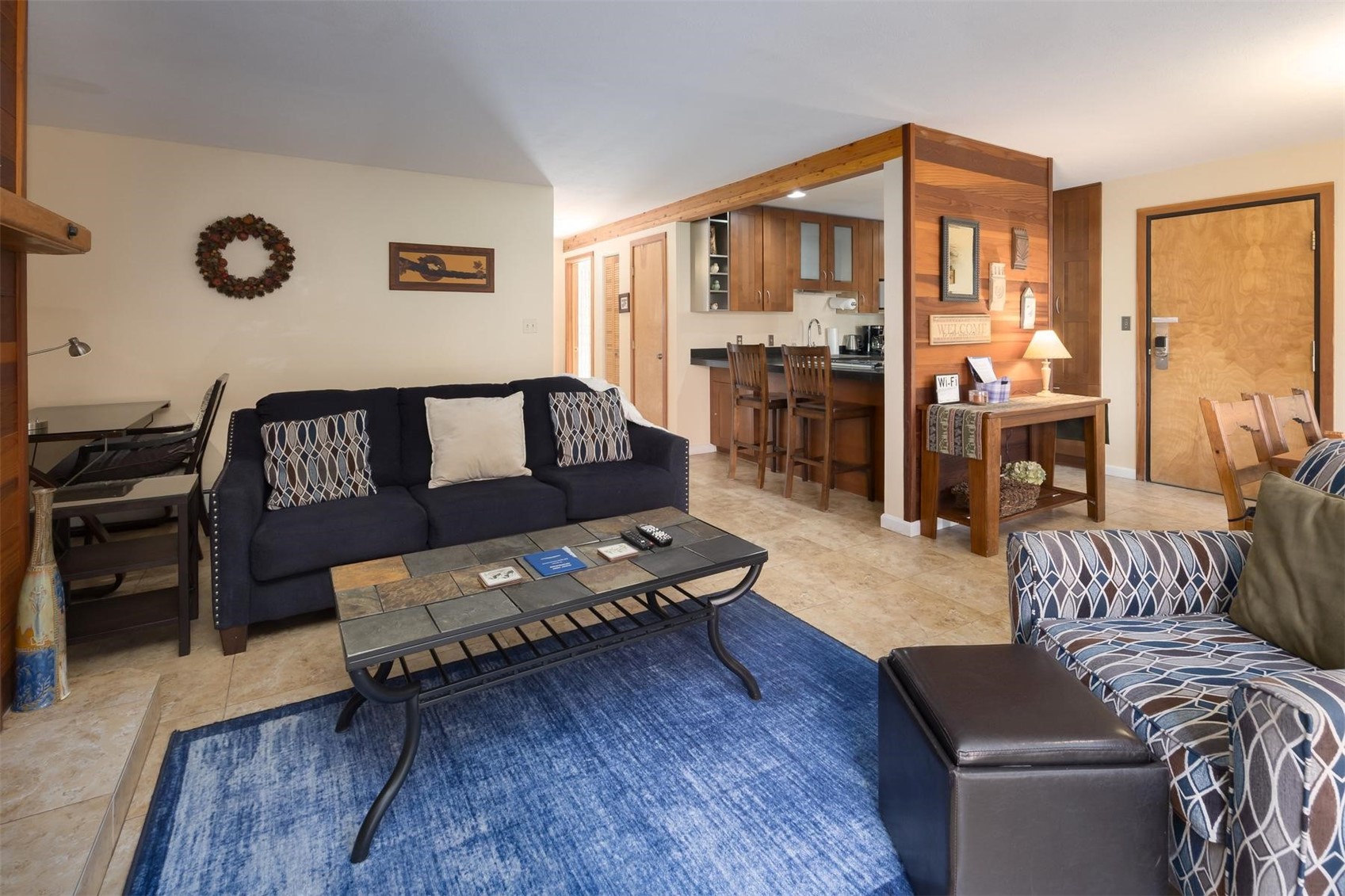 91100 Ryan Gulch Road, Unit 91105 Silverthorne, CO 80498 - Photo 5 of 49 a living room with furniture and wooden floor