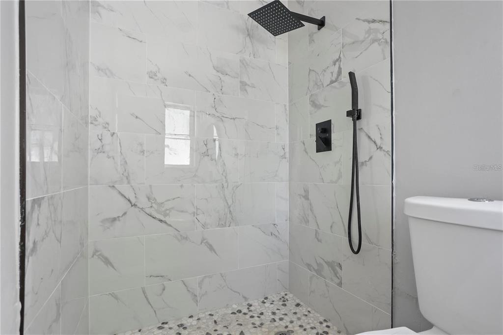 6615 Renssalaer Drive Bradenton, FL 34207 - Photo 11 of 31 a bathroom with a shower