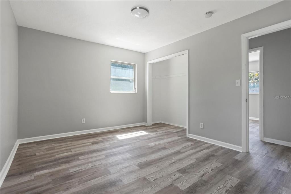 6615 Renssalaer Drive Bradenton, FL 34207 - Photo 16 of 31 a view of an empty room with wooden floor and a window