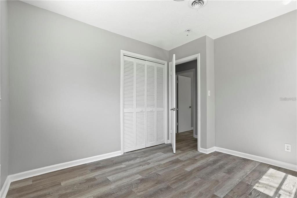 6615 Renssalaer Drive Bradenton, FL 34207 - Photo 18 of 31 a view of an empty room with wooden floor