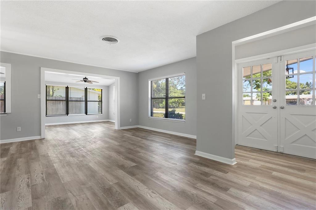 6615 Renssalaer Drive Bradenton, FL 34207 - Photo 22 of 31 a view of an empty room with wooden floor and a window