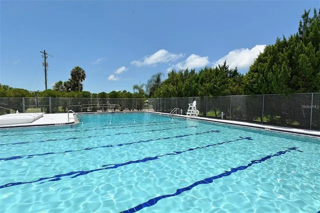 a view of a fountain in front of a house