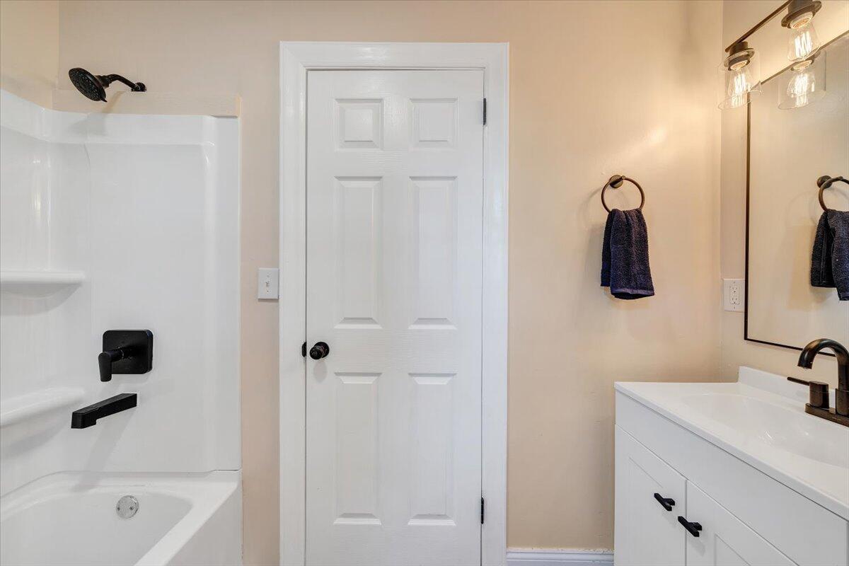 1433 Chalk Level Road Chatham, VA 24531 - Photo 15 of 41 a bathroom with a tub sink and mirror