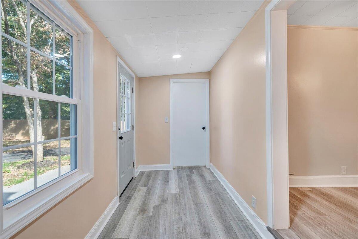 1433 Chalk Level Road Chatham, VA 24531 - Photo 31 of 41 a view of hallway with a large window and wooden floor