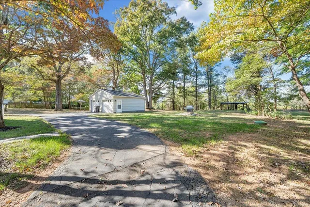 a view of yard with tree s
