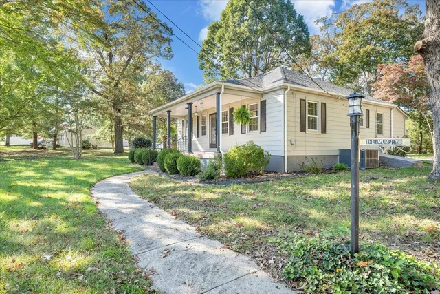 a front view of a house with a yard
