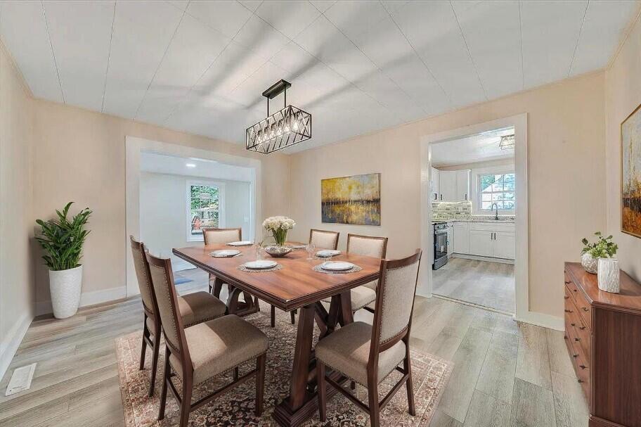 1433 Chalk Level Road Chatham, VA 24531 - Photo 8 of 41 a view of a dining room with furniture and wooden floor
