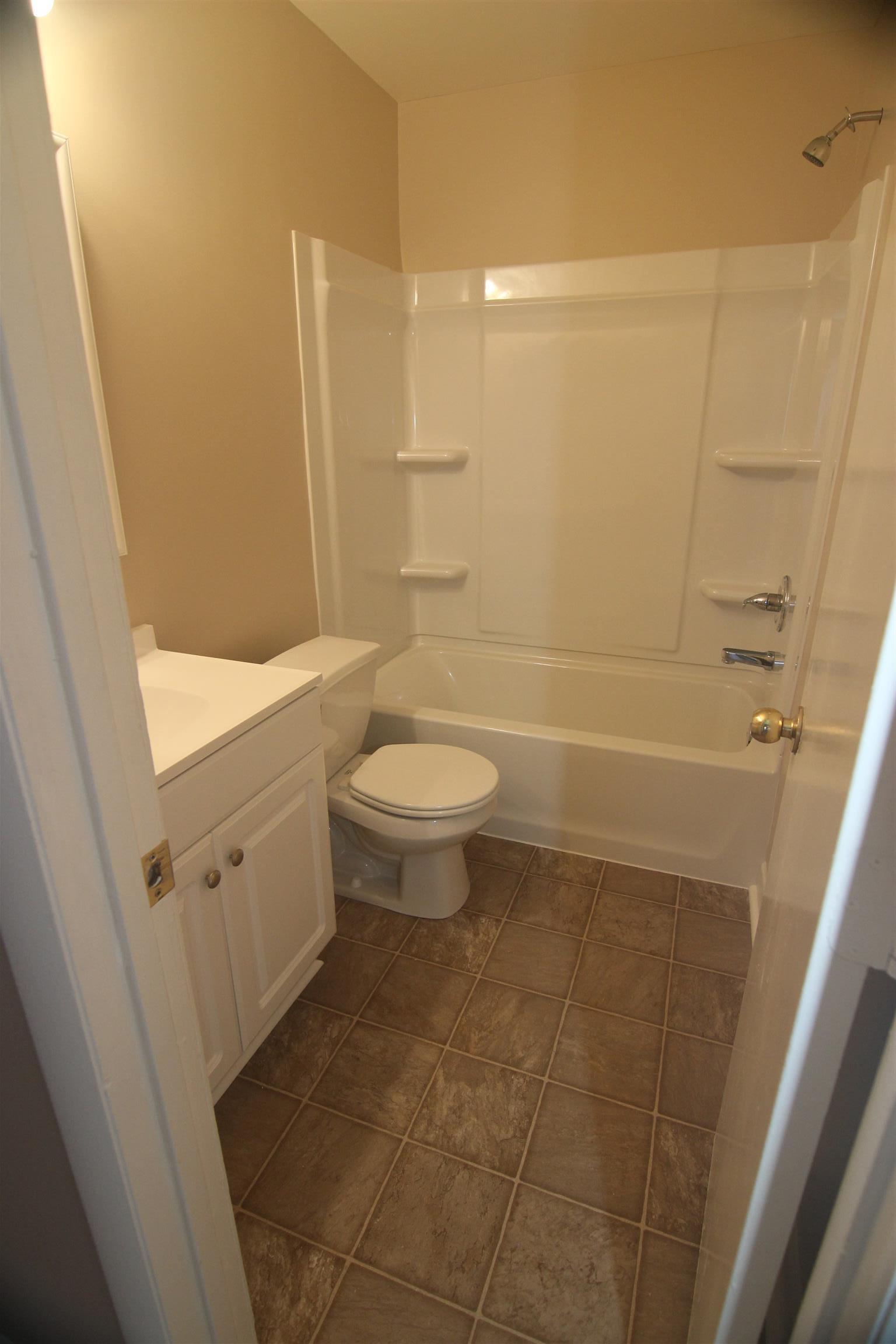 1245 Old Lascassas Road, Unit F Murfreesboro, TN 37130 - Photo 9 of 9 a bathroom with a sink a toilet and shower