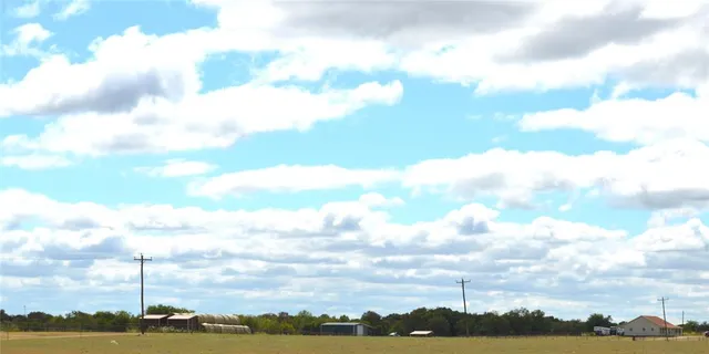 an aerial view of a house with outdoor space