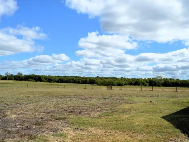 a view of a lake with a big yard
