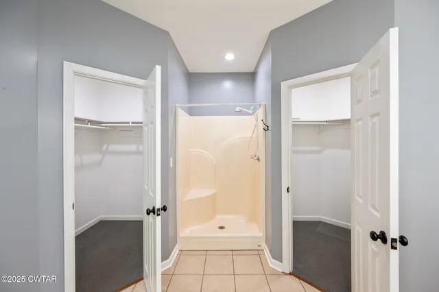 wooden floor with a bathroom
