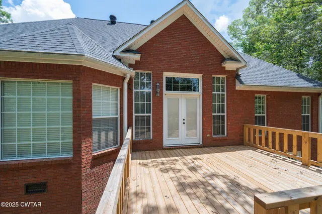 a view of a house with a door and wooden floor