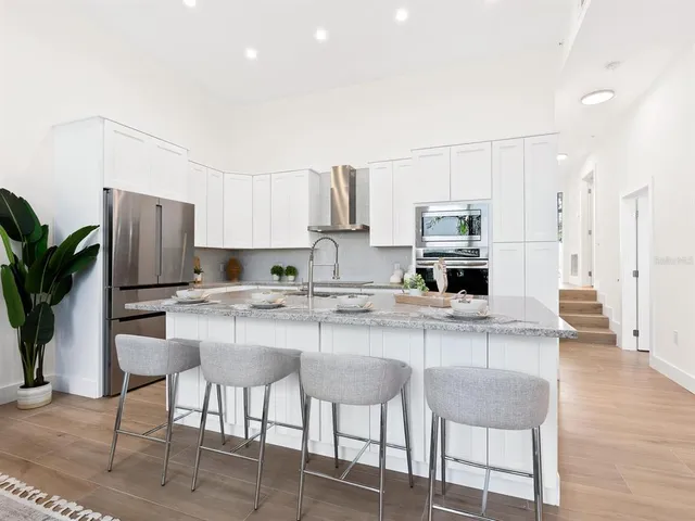a view of hall way with furniture and window