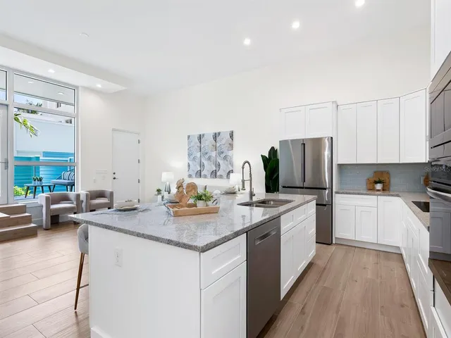 a bathroom with a double vanity sink mirror and shower
