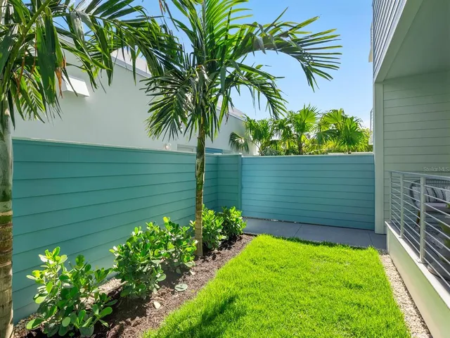 a view of a living room and a balcony