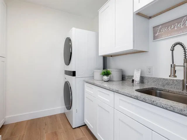 a view of an empty room with a kitchen