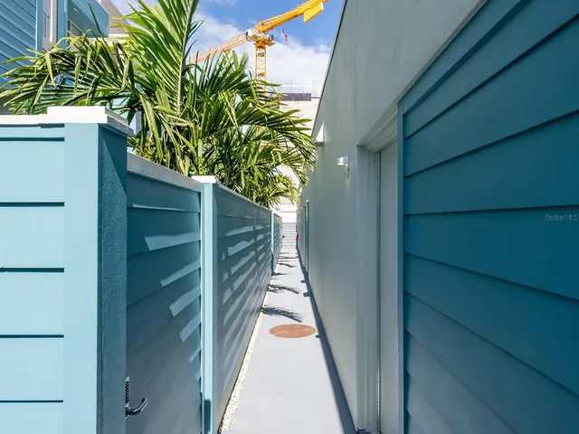 a view of a house with a small yard and plants