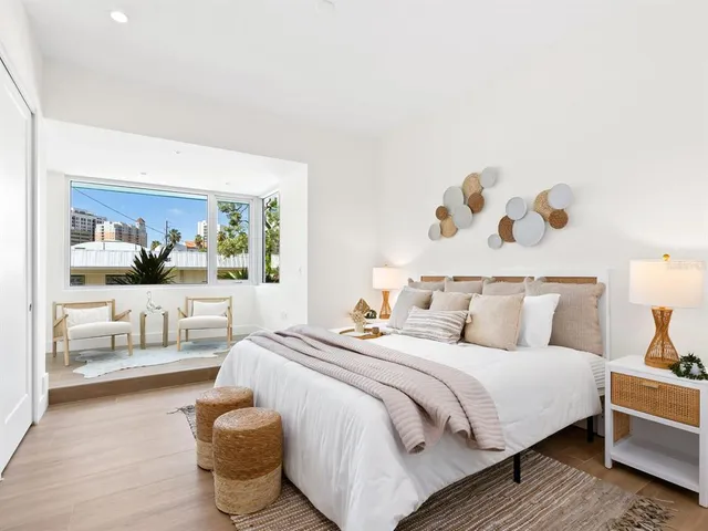 an aerial view of city and lake