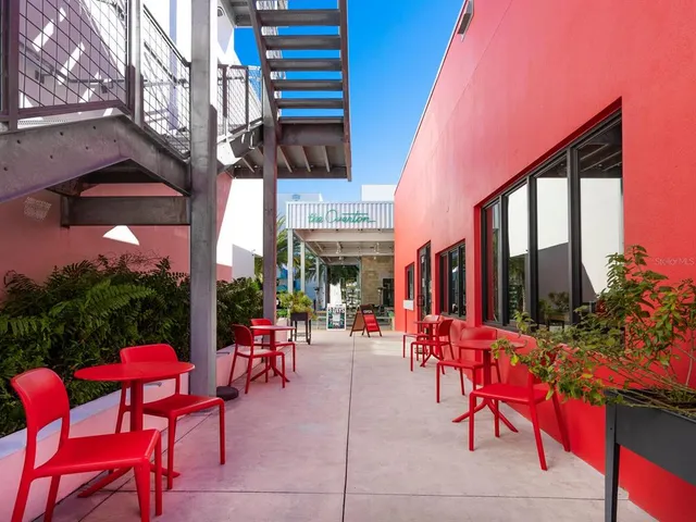 a view of parked cars in front of building