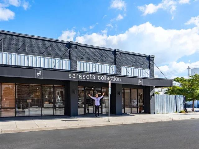 a view of a house with a porch and furniture