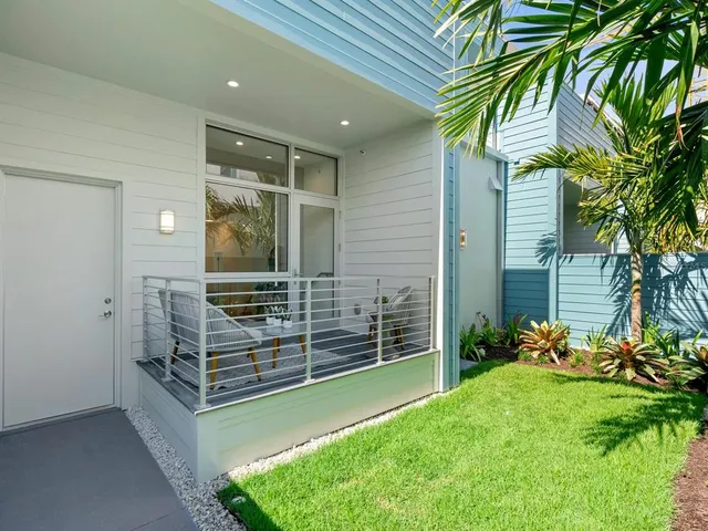 a balcony with table and a chairs