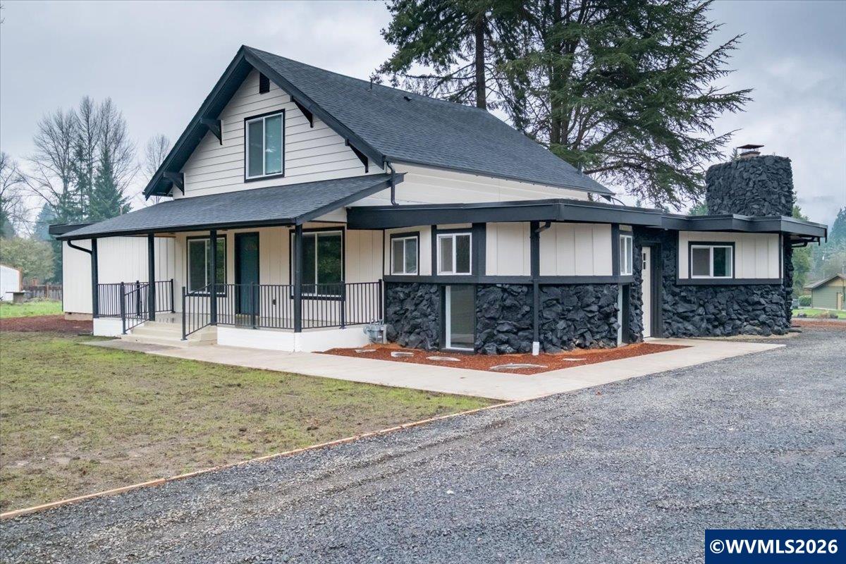 28411 Liberty Road Sweet Home, OR 97386 - Photo 5 of 50 a front view of a house with a yard and garage