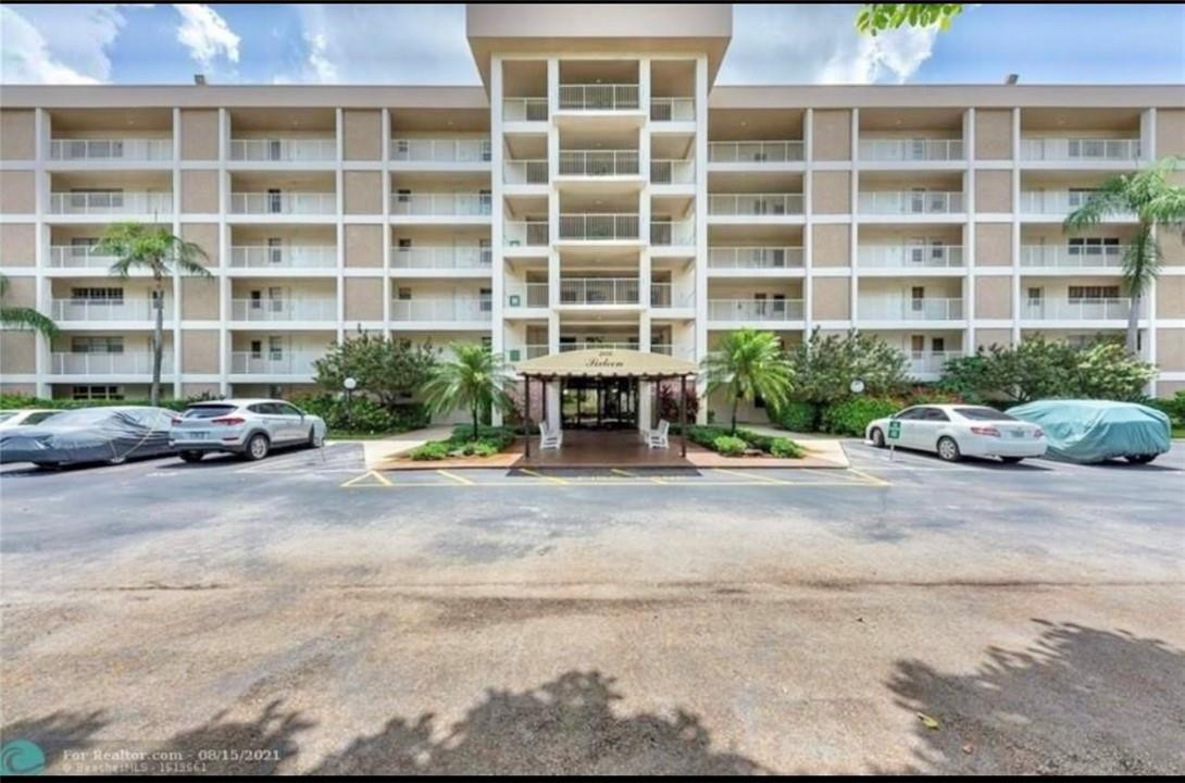 2650 South Course Drive, Unit 603 Pompano Beach, FL 33069 - Photo 1 of 25 a front view of a building with a street