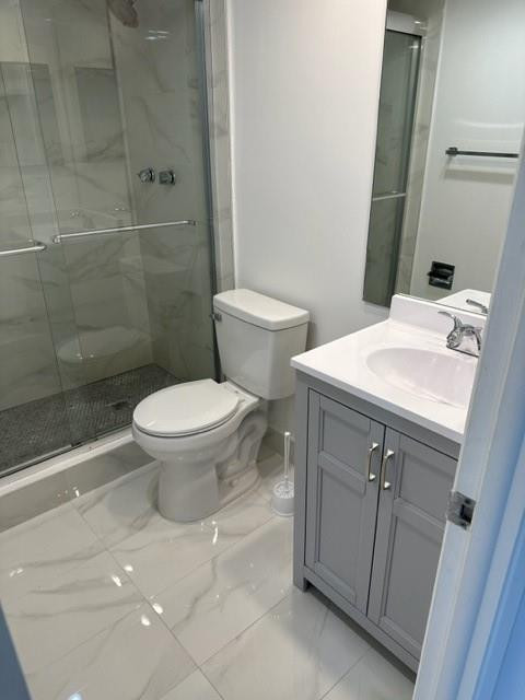 2650 South Course Drive, Unit 603 Pompano Beach, FL 33069 - Photo 12 of 25 a bathroom with a sink a toilet and a mirror