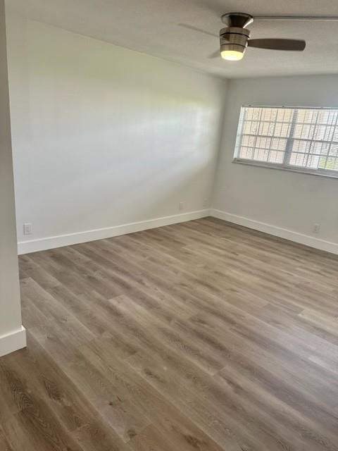 2650 South Course Drive, Unit 603 Pompano Beach, FL 33069 - Photo 14 of 25 wooden floor in an empty room with a window