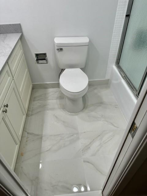 2650 South Course Drive, Unit 603 Pompano Beach, FL 33069 - Photo 16 of 25 a bathroom with a toilet and a shower