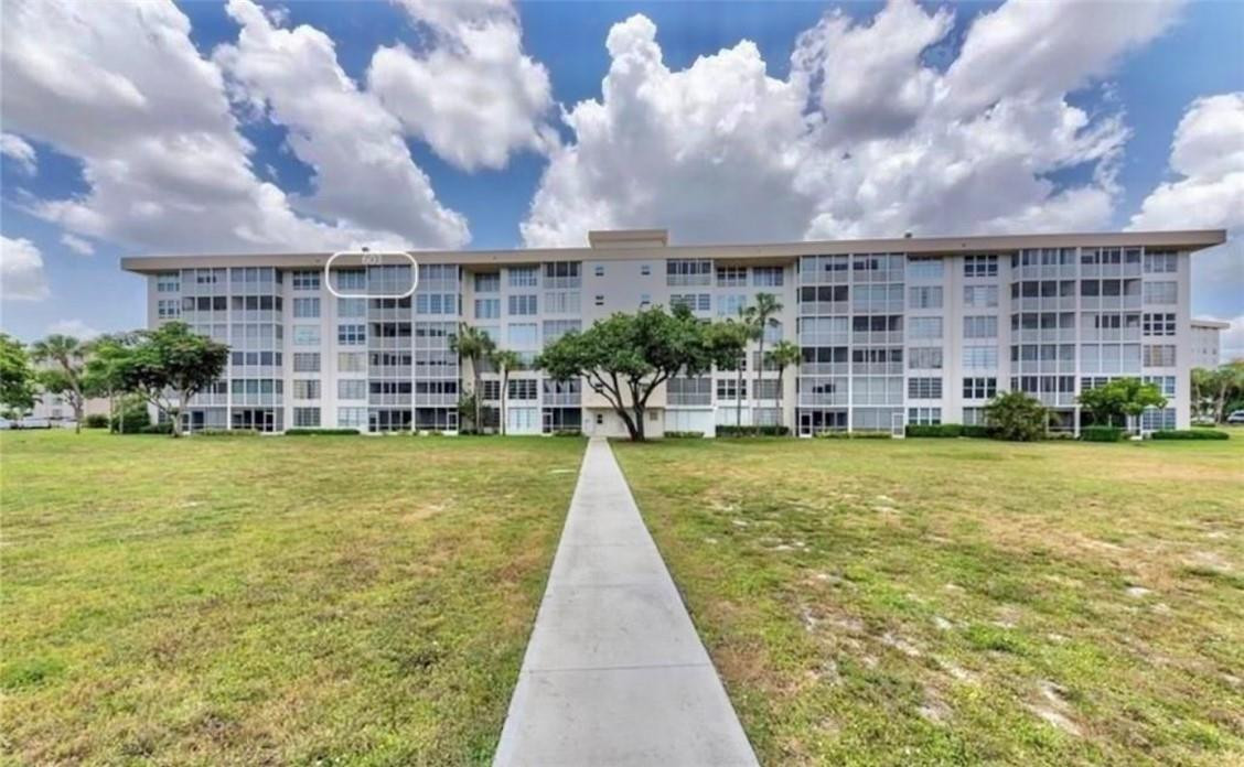 2650 South Course Drive, Unit 603 Pompano Beach, FL 33069 - Photo 5 of 25 a view of building with yard