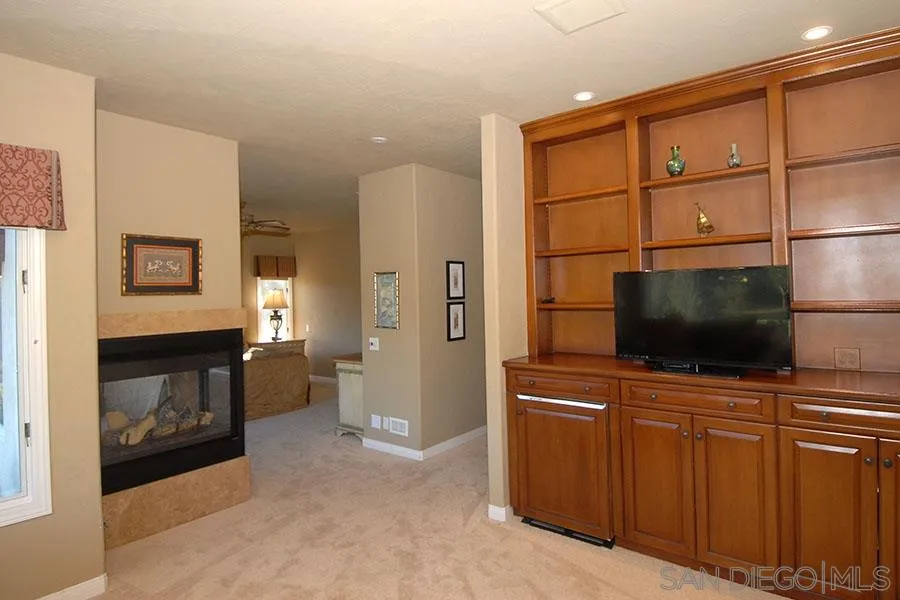 6515 Poco Lago Rancho Santa Fe, CA 92091 - Photo 12 of 25 a living room with furniture and a flat screen tv