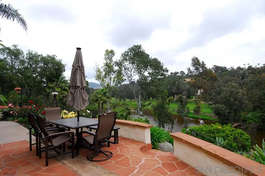 6515 Poco Lago Rancho Santa Fe, CA 92091 - Photo 18 of 25 a view of a tables and chairs in the patio