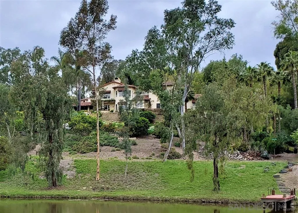 6515 Poco Lago Rancho Santa Fe, CA 92091 - Photo 22 of 25 a aerial view of a house with a yard