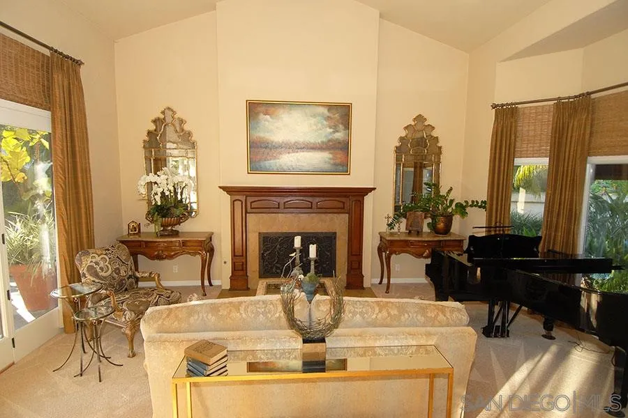 6515 Poco Lago Rancho Santa Fe, CA 92091 - Photo 6 of 25 a living room with fireplace furniture and a fireplace