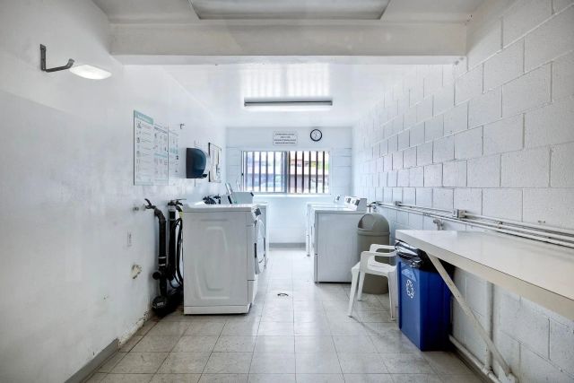 a bathroom with a sink mirror and toilet