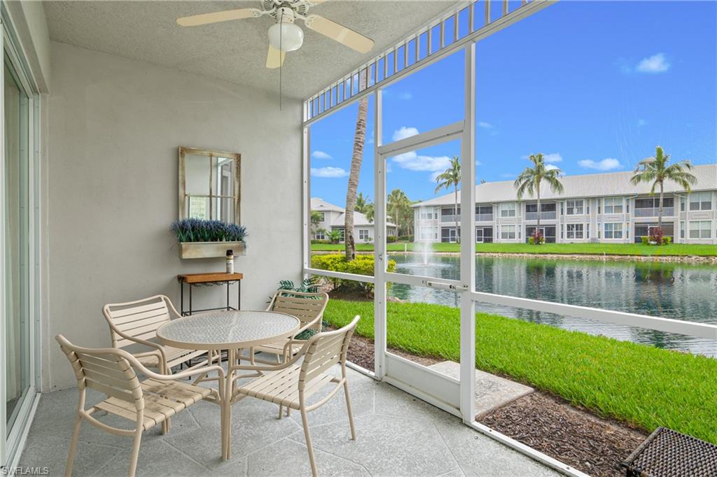 791 14th Street Northeast Naples, FL 34120 - Photo 39 of 46 Sunroom / solarium with a water view, a ceiling fan, outdoor dining space, and a patio area