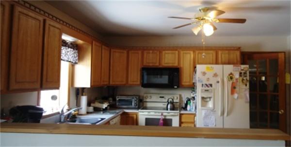 120 Clapp Road Hardwick, MA 01037 - Photo 14 of 20 a kitchen with a refrigerator a stove a sink and a window