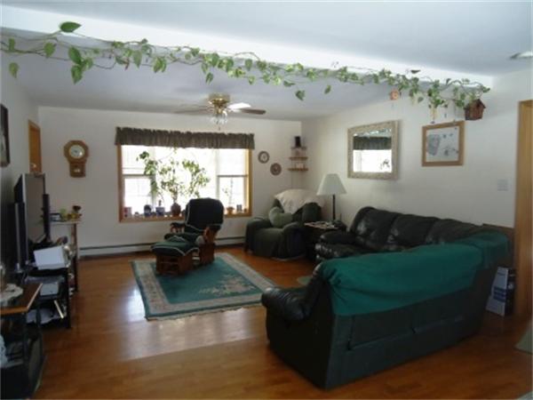 120 Clapp Road Hardwick, MA 01037 - Photo 7 of 20 a living room with furniture chandelier and a chandelier