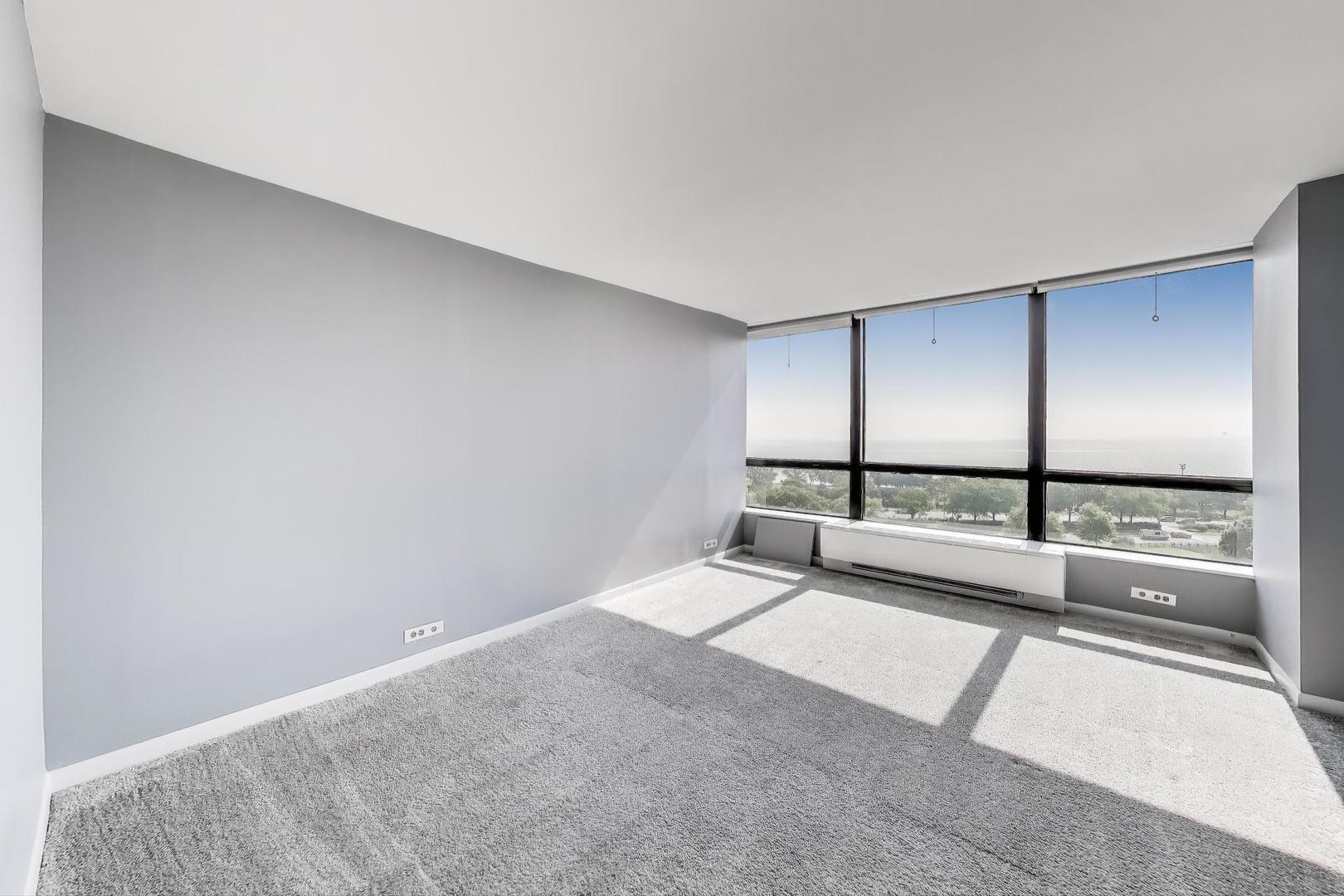 5415 North Sheridan Road, Unit 1401 Chicago, IL 60640 - Photo 20 of 46 a view of an empty room with a window