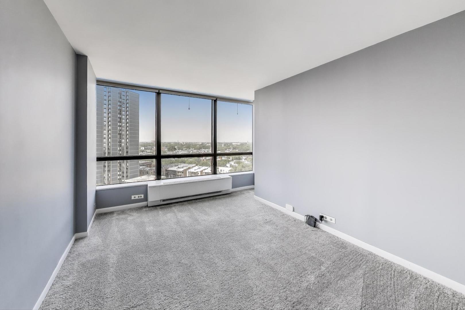 5415 North Sheridan Road, Unit 1401 Chicago, IL 60640 - Photo 25 of 46 an empty room with large windows
