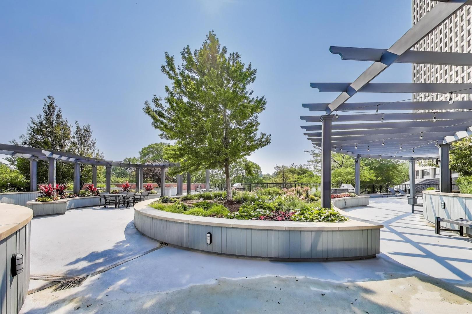 5415 North Sheridan Road, Unit 1401 Chicago, IL 60640 - Photo 41 of 46 a view of a swimming pool with a outdoor seating