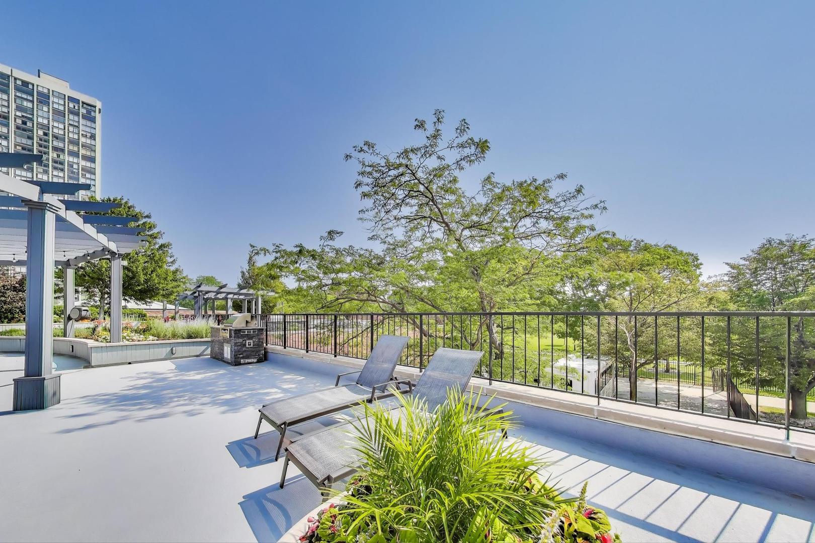 5415 North Sheridan Road, Unit 1401 Chicago, IL 60640 - Photo 43 of 46 a view of a swimming pool with a patio