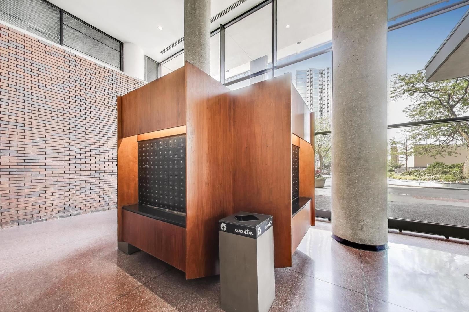 5415 North Sheridan Road, Unit 1401 Chicago, IL 60640 - Photo 7 of 46 a view of an entryway with wooden floor and windows